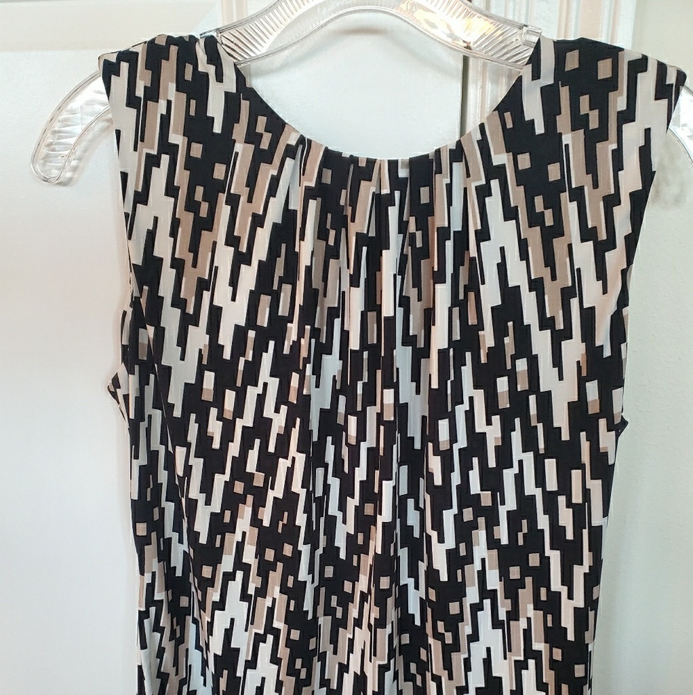 Calvin Klein black, white, and ecru sleek top. S.